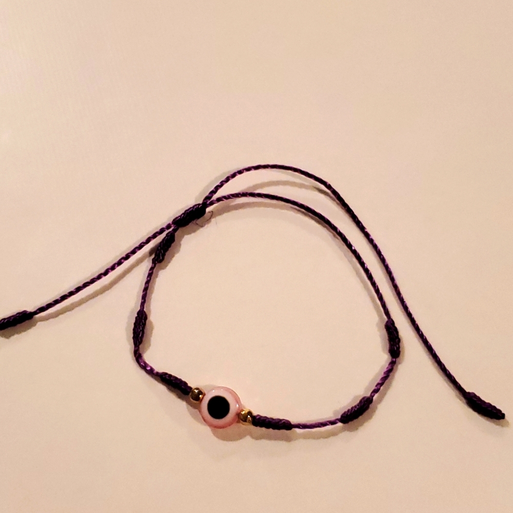 Pink Evil eye bracelet with purple string